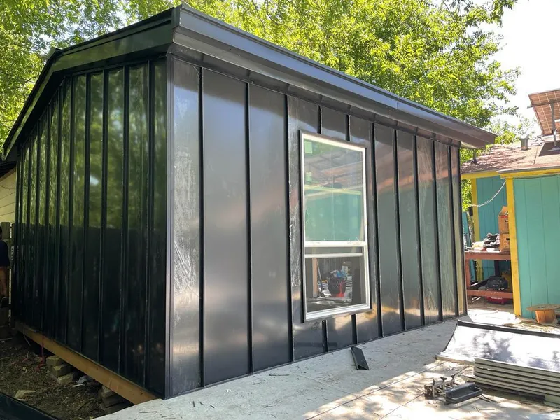 Black standing seam metal wall panels for Roof Inspection in Tukwila